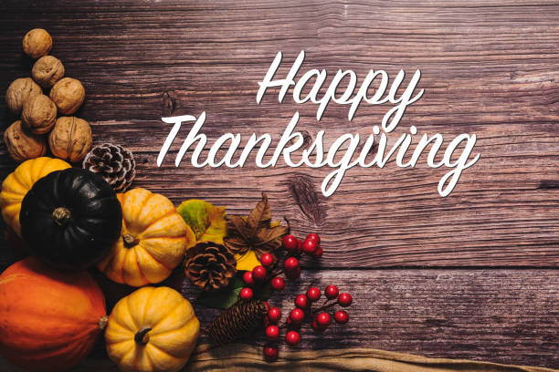 istock Happy Thanksgiving Day with pumpkin and nut on wooden table 1280515078