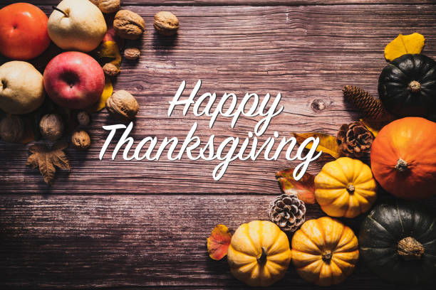 istock Happy Thanksgiving Day with pumpkin and nut on wooden table 1280515334