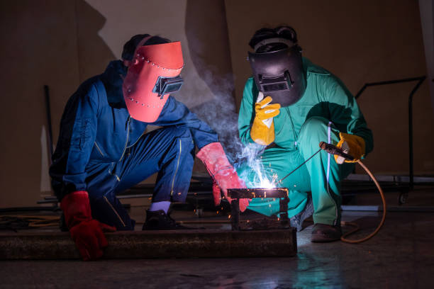istock Metal welding steel works using electric arc welding machine 1280522321