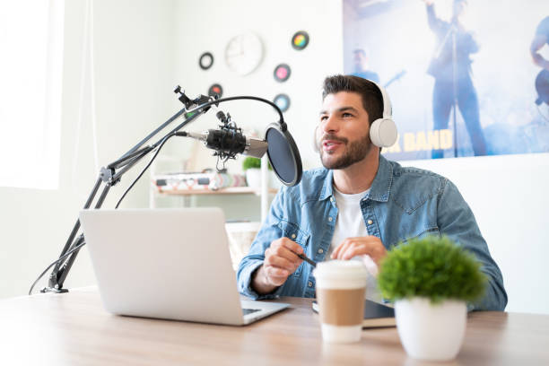 istock Blogger recording podcast in a studio 1280522979