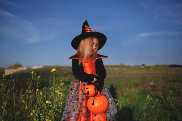 istock little girl dressed as a witch celebrates halloween 1280526012