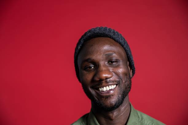 istock Young Black Man Smiling on Isolated Background 1280527654