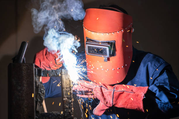 istock Metal welding steel works using electric arc welding machine 1280527848