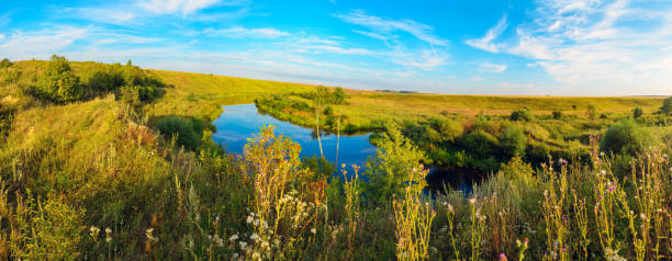 istock Beautiful summer landscape with calm river at sunset 1280529964