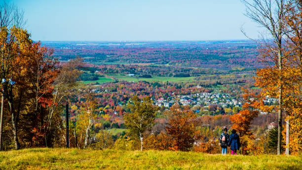 People hiking on Bromont mountain in autumn quebec Bromont, Canada - Oct. 11 2020: People hiking on Bromont mountain in autumn quebec montérégie photos stock pictures, royalty-free photos & images