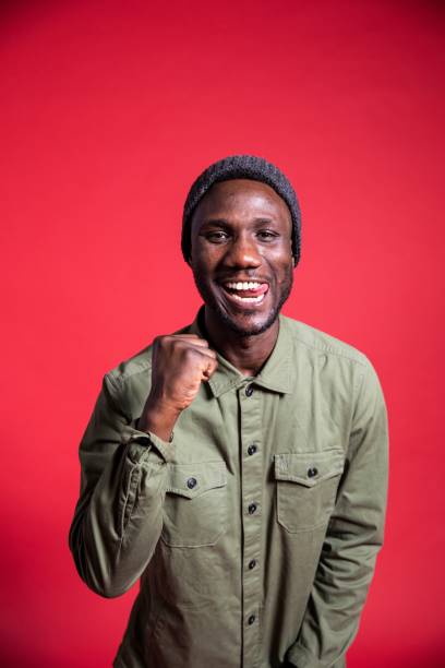 istock Young Black Man with Happing Winning Facial Expression 1280531130