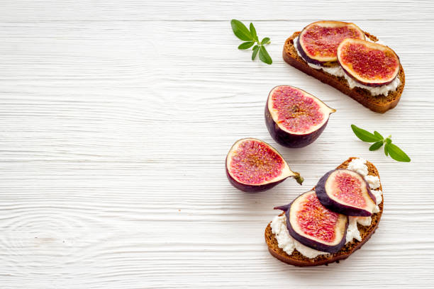 istock Canape or sandwich with figs and cheese, overhead view 1280532404