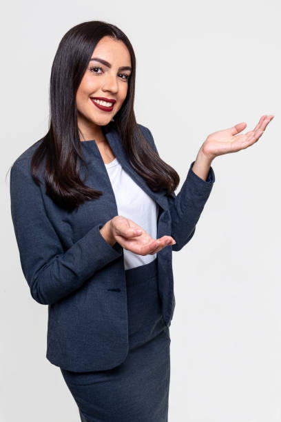 istock Elegant executive woman smiling and isolated on white background 1280536163