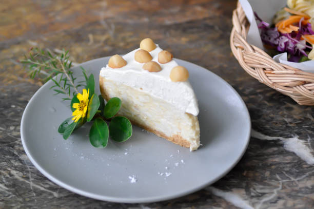 istock coconut cake with cream and macadamia 1280536678