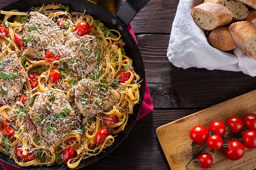 Healthy Chicken Fettuccine Skillet with Basil, Tomato and Parmesan.