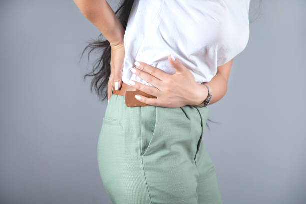 istock woman hand in ache back 1280547024