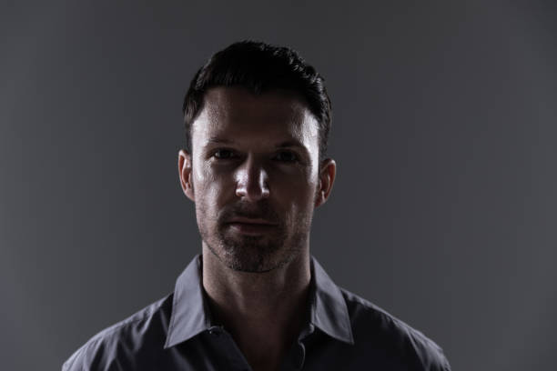 istock Portrait of young man against grey background 1280548018