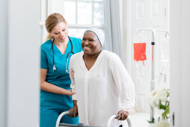 istock Nurse assists patient with walker 1280549732