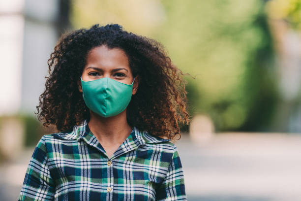 istock Woman's portrait with protective face mask COVID-19 1280554342