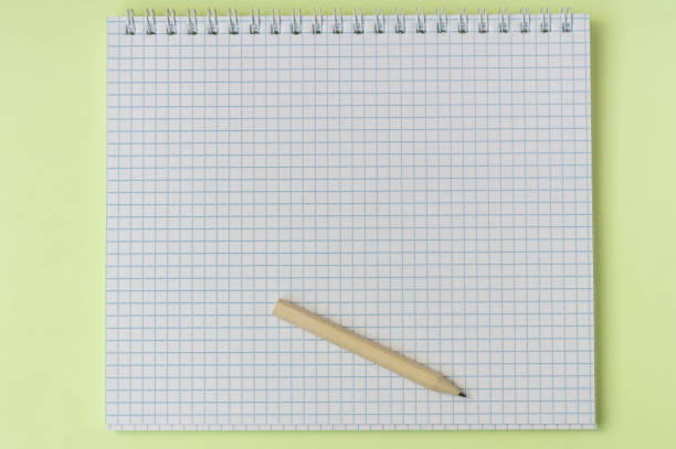 istock student empty notebook with wooden brown short penil on yellow background 1280555103