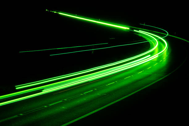 istock green car lights at night. long exposure 1280558163