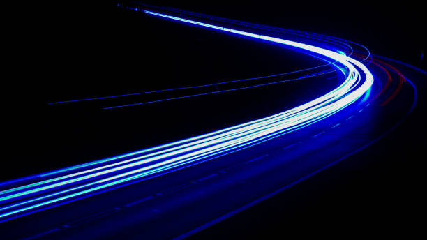 istock blue car lights at night. long exposure 1280558169
