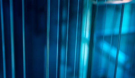 Blue glass and stainless steel background.