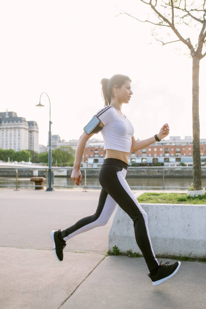 istock Woman running in city 1280562738