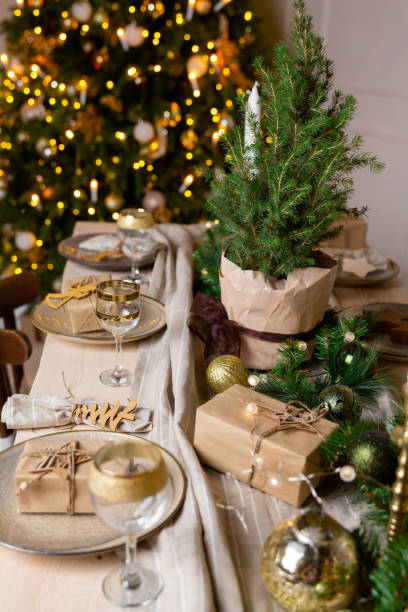 istock Christmas or New Year decoration of the festive table. Table setting with dishes. Spruce tree decoration 1280565954