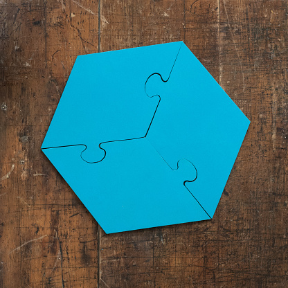 Puzzle pieces on table solving a game for fun and achievement jigsaw