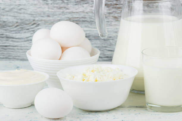 istock Different dairy products on the white wooden boards 1280569562