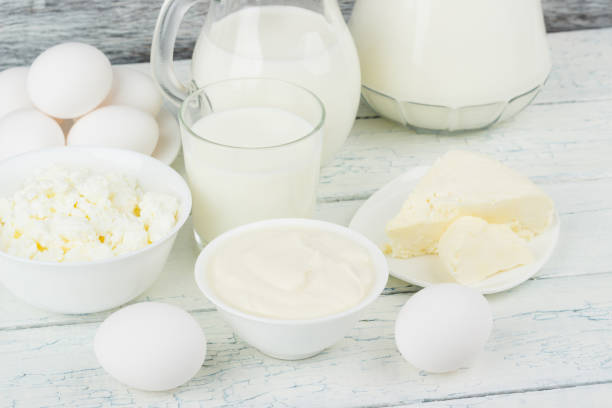 istock Different dairy products on the white wooden boards 1280571196