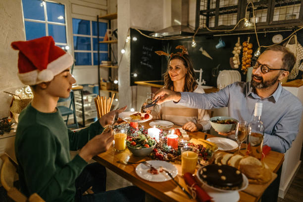 istock Family having Christmas dinner at dining table 1280571883