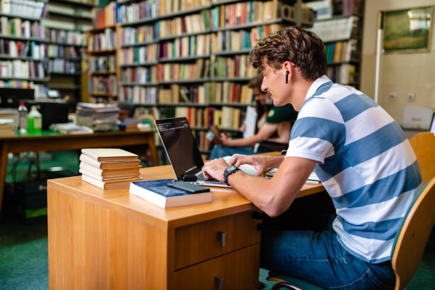 istock Hardworking University student looking for information for his research on a internet 1280573362