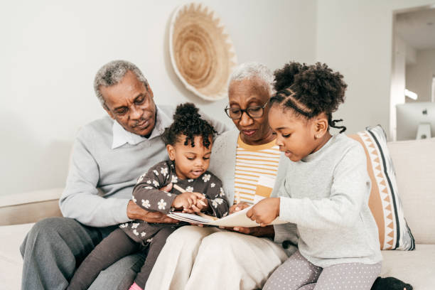 istock Three generation family together sitting on sofa 1280573425