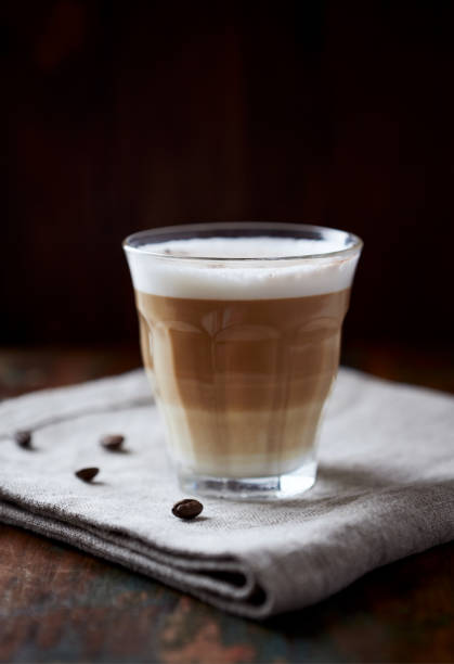istock Coffee with milk on dark wooden background. Close up. 1280573901