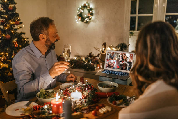 istock Couple online chatting with friends having Christmas dinner 1280576278