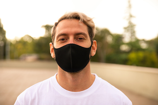 Portrait Of Man With Mask On The Street