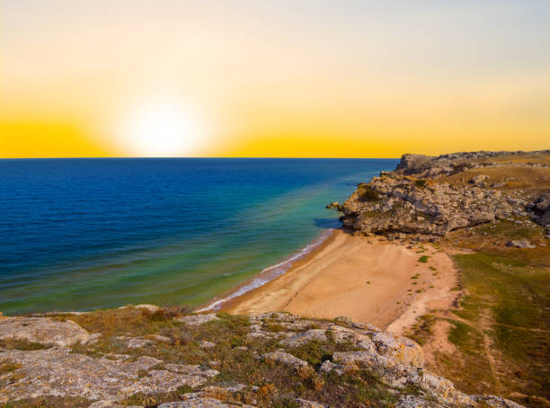 istock emerald sea bay with stony coast at the sunset 1280581875