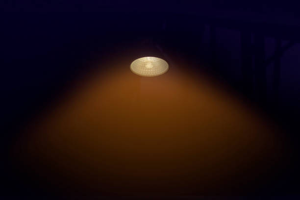 istock Lamp in dark room. Copy space for text. 1280587433