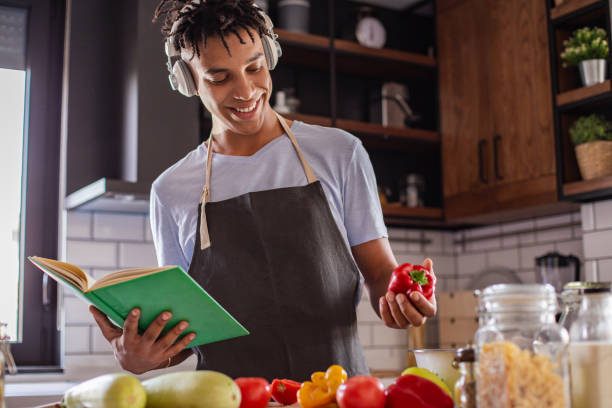 istock Young African American man is cooking in the kitchen 1280589633