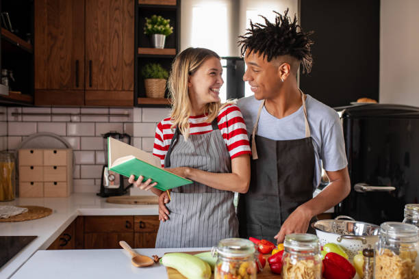 istock Young couple is looking for recipes 1280590554