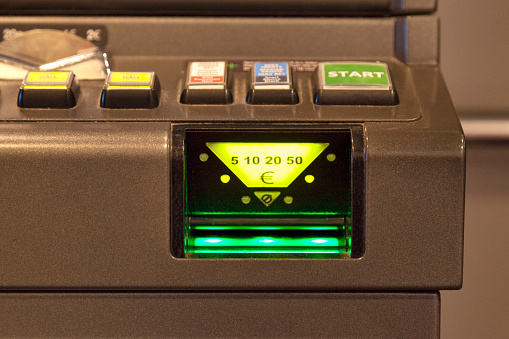 Close-up of the bill acceptor of a slot machine.