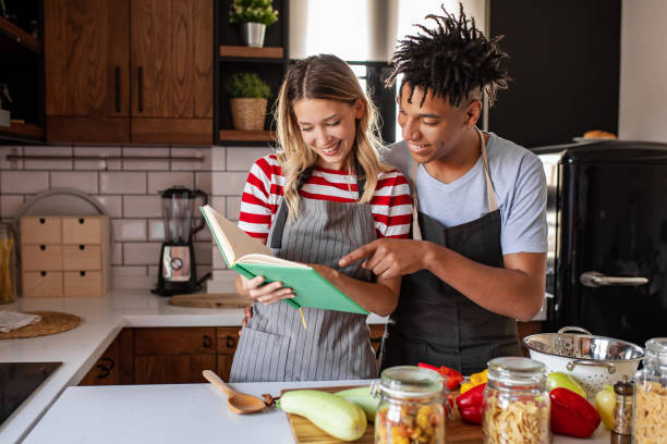 istock Young couple is looking for recipes 1280590684