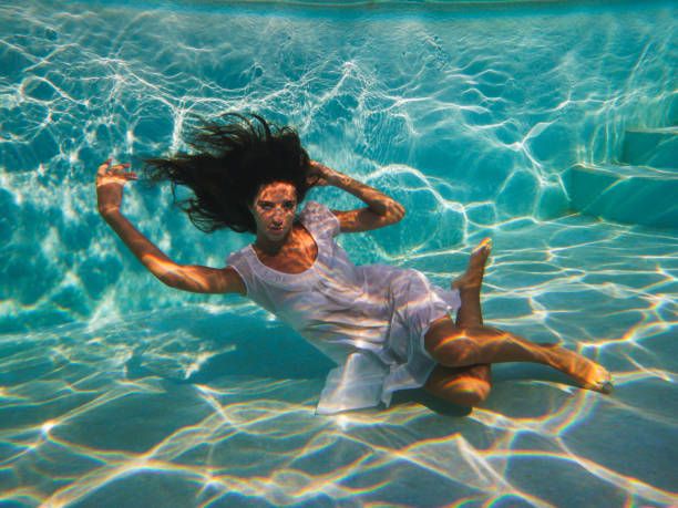 istock Young girl under water 1280591044