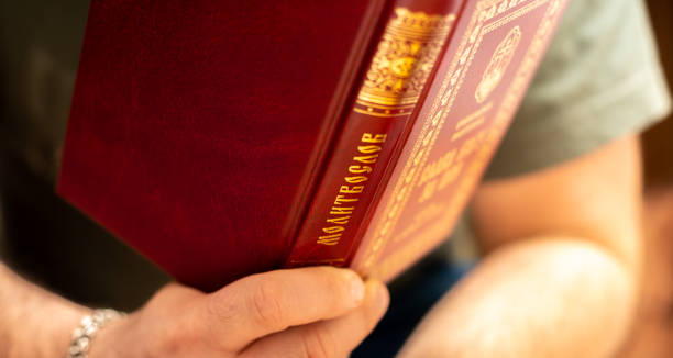 istock man reads prayers in the prayer book. Translate: Prayer book 1280599393