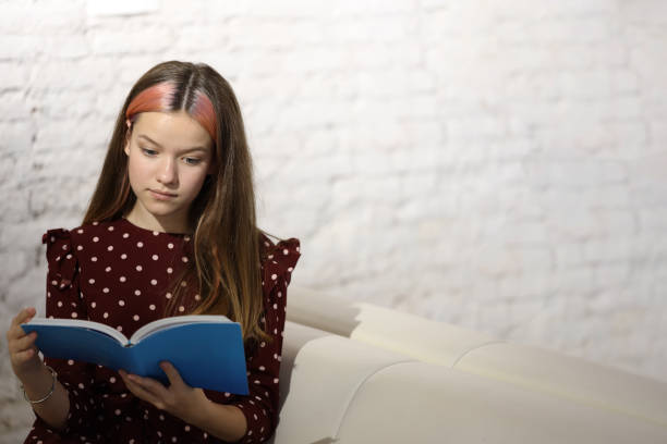 istock young beautiful girl reading a book 1280601820