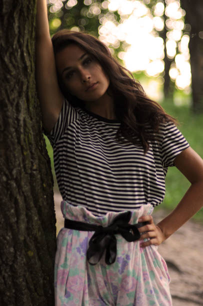 istock Young beautiful girl in the park 1280602377