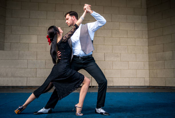 istock Elegant man and woman dancers 1280603260