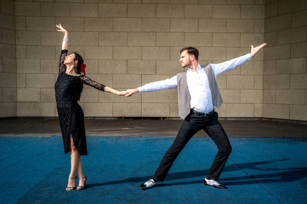 istock Man and woman dancing on stage 1280604722