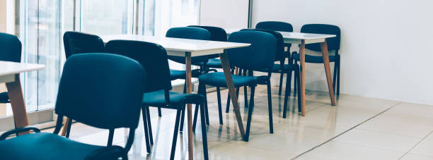 istock Coworking room space with tables and chairs 1280605915