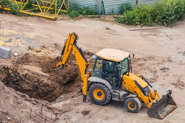 istock High angle view of yellow mini excavator on construction site digging a pit 1280610316