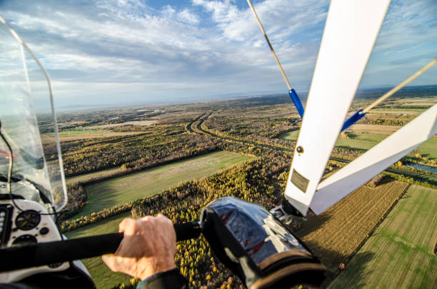 istock Pilot flying in his ultra light plane 1280613847