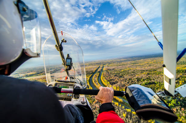 istock Pilot flying in his ultra light plane 1280614173