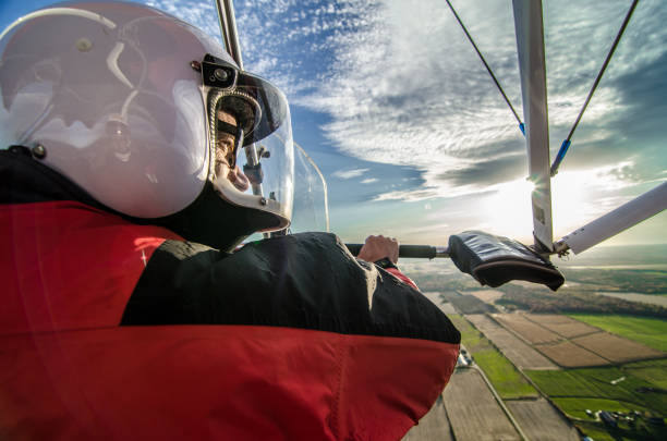 istock Pilot flying in his ultra light plane 1280614755